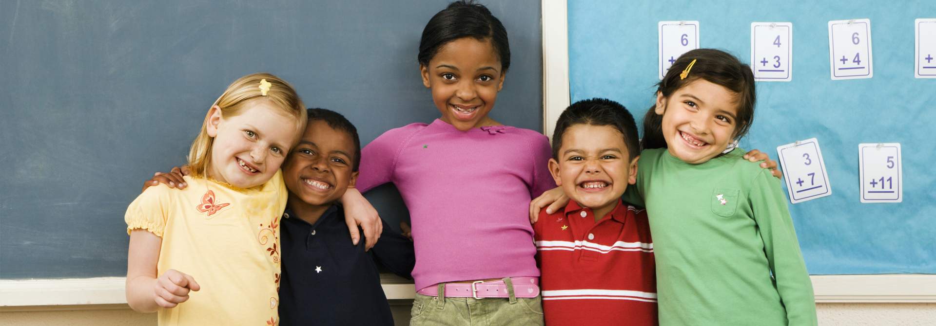 banner image with five smiling children