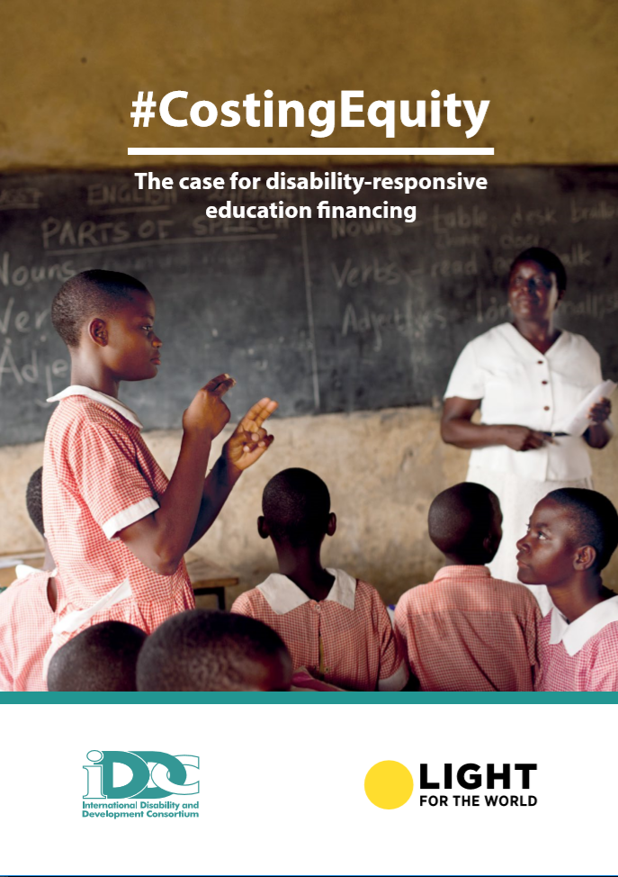 Students with disabilities in a classroom and a teacher in the background