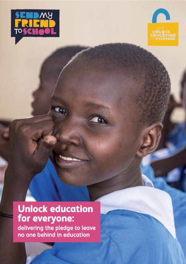 African child looking at the camera while sitting in a classroom
