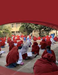 Children with textbooks in a school courtyard 